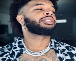 Brandon has piercing in his ears and nose. Also seen wearing thick chain in his neck.